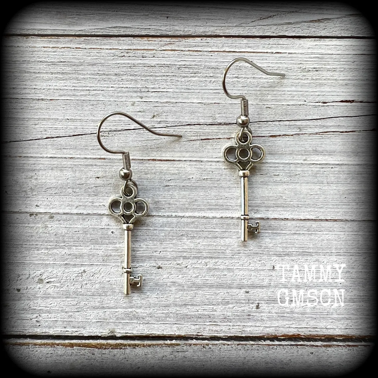 Small antique silver key earrings