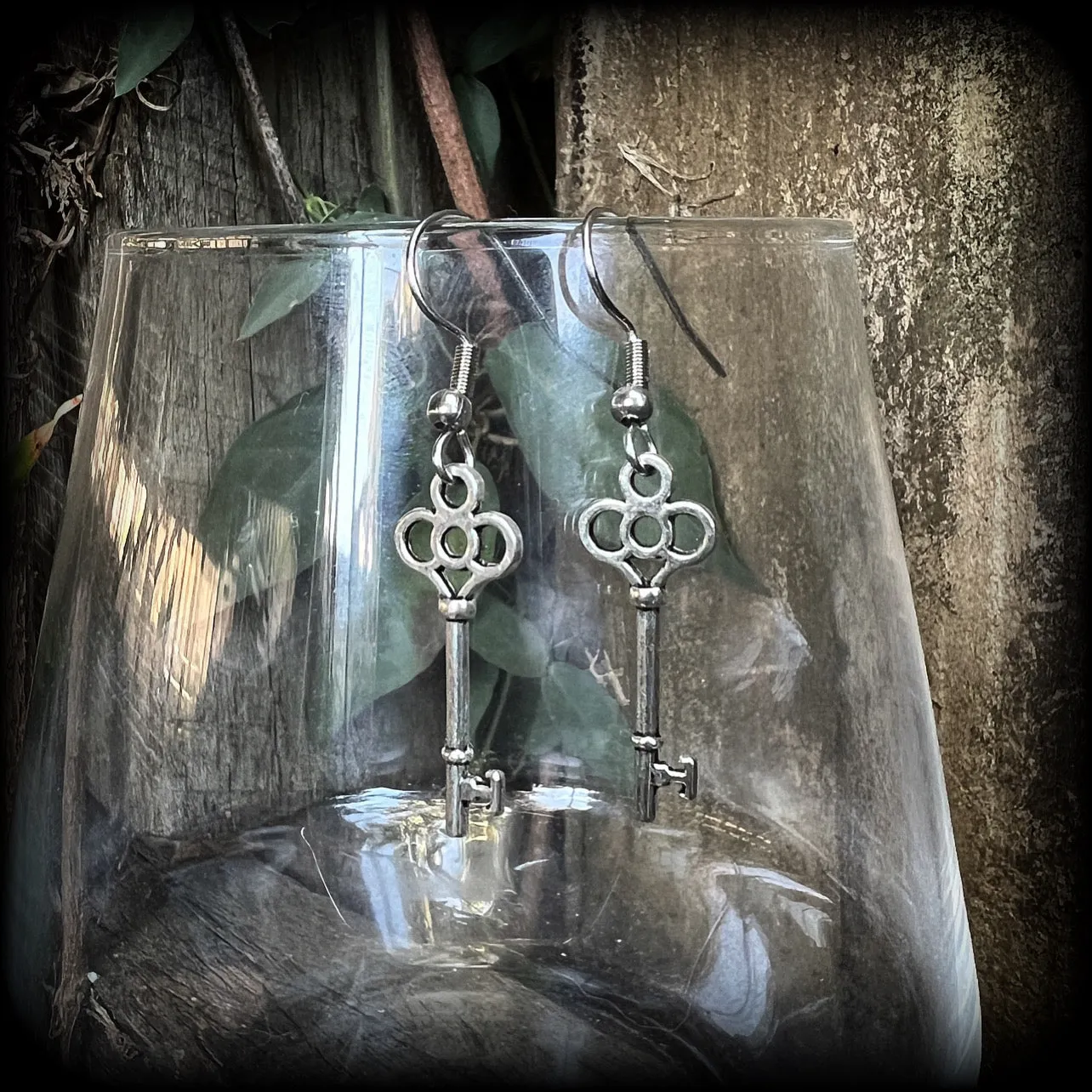 Small antique silver key earrings